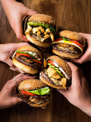 Friends Sharing Hamburgers at Roam Artisan Burgers